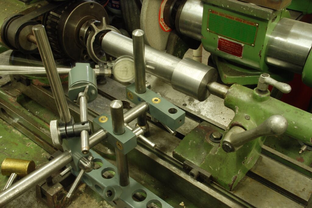 Alignment tool being used to set up work on the cylindrical grinder