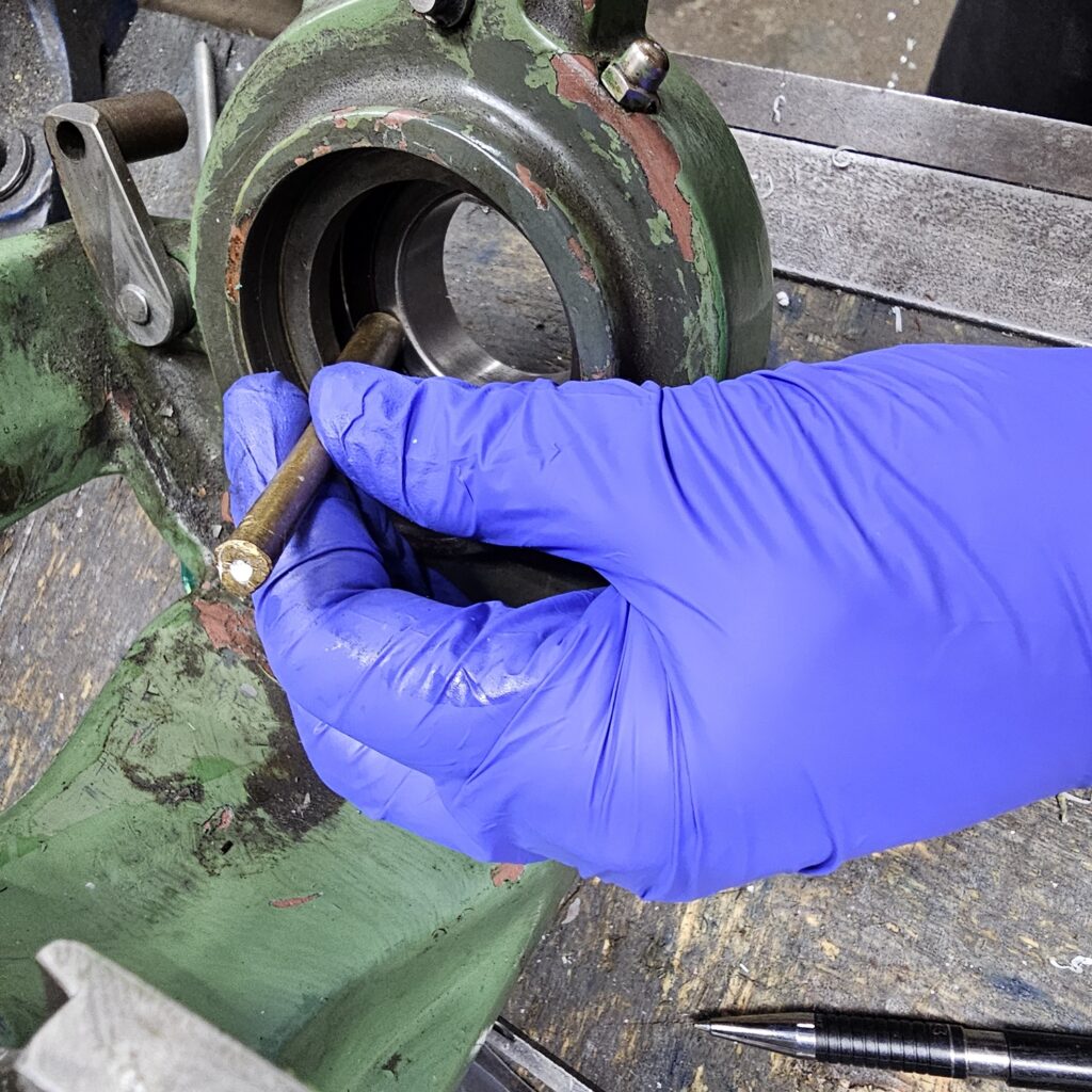 The spindle comes out.  Note the spanners . make or buy spanners that fit the nuts; don't be a hack!